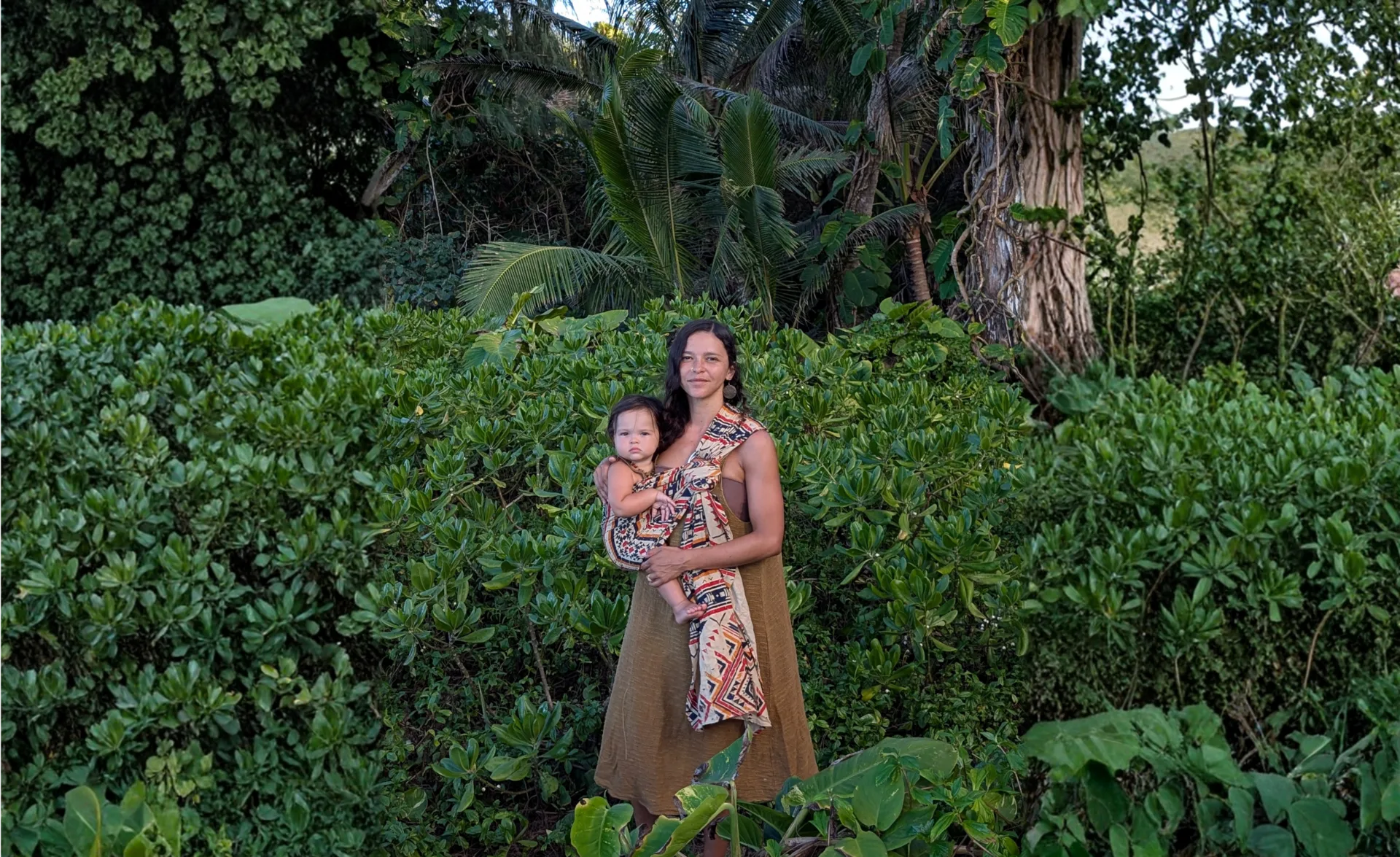 Parent wearing ring sling with baby